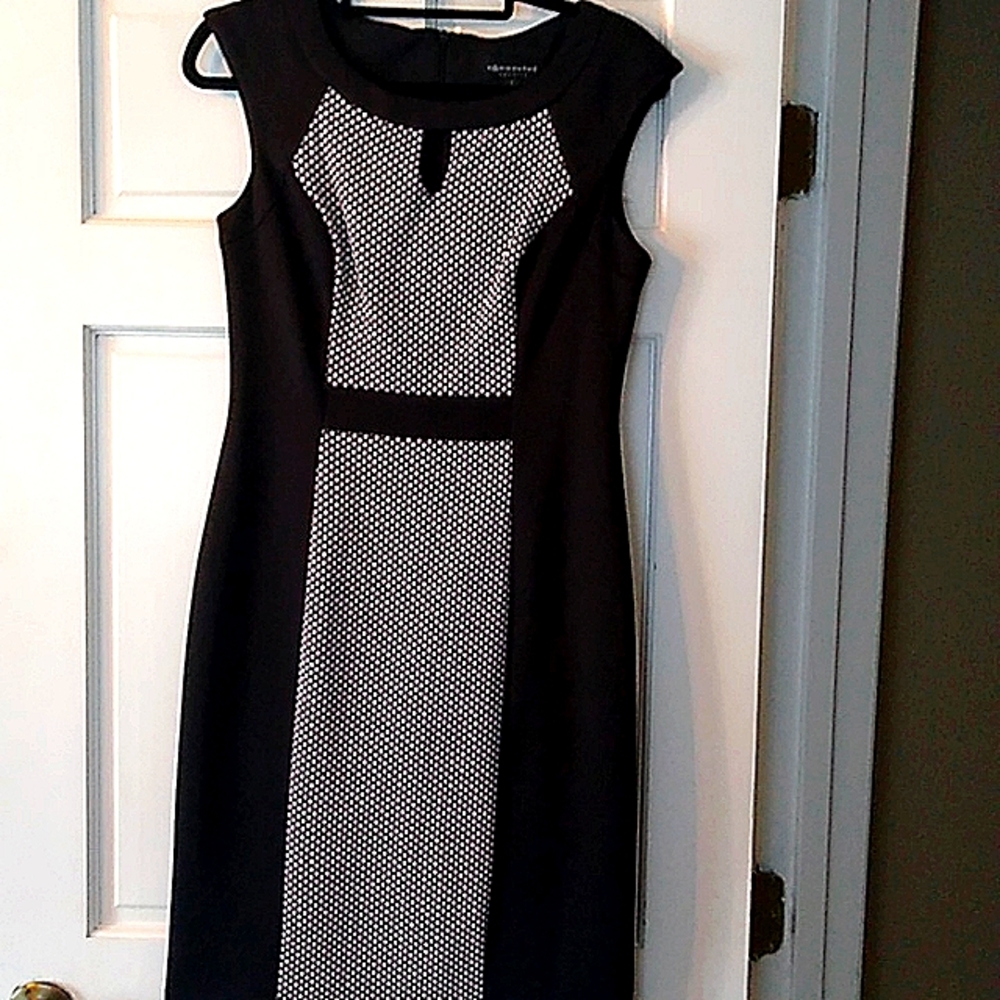 Sleeveless black and white sheath dress